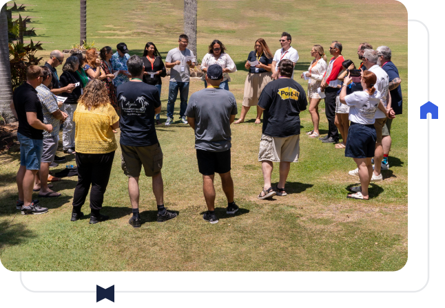 A group of people gathered outside at an Agile Coaching Retreat