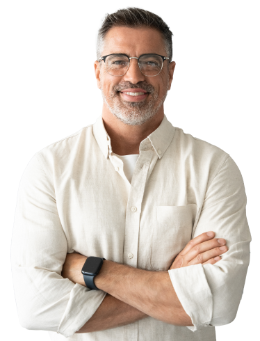 Hero-Conflict-Management-Skills A man wearing glasses and a white button up crosses his arms and smiles against a white background