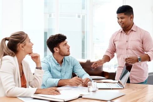 Group of people at a work desk