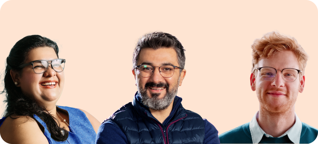 Three smiling professionals in orange background